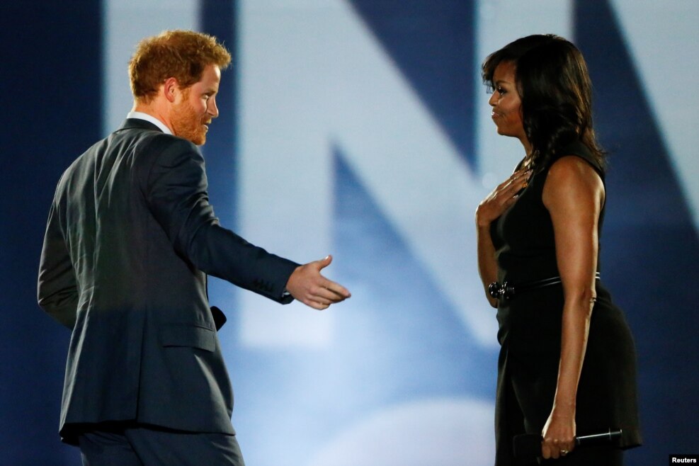 Britain's Prince Harry (L) and U.S. First Lady Michelle Obama take part in the opening ceremonies of the Invictus Games in Orlando, Florida, U.S., on May 8, 2016.