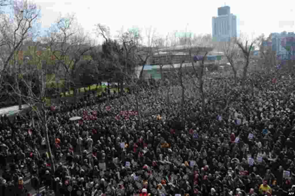 Tens of thousands of protesters march to mark the fifth anniversary of Turkish-Armenian journalist Hrant Dink's murder in Istanbul, Turkey, Thursday, Jan. 19, 2012, as outrage continues to grow over a trial that failed to shed light on alleged official ne