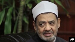 FILE - Grand Sheikh of Al-Azhar, the highest Islammic Sunni institution, Ahmed Al-Tayeb looks on during his meeting with Egyptian presidency candidate Mohamed ElBaradei, not pictured, in Cairo, Egypt, Aug. 8, 2011. 