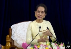 REPORT - Myanmar leader Aung San Suu Kyi speaks at the Yangon University Conference Hall on August 28, 2018 in Yangon, Myanmar.