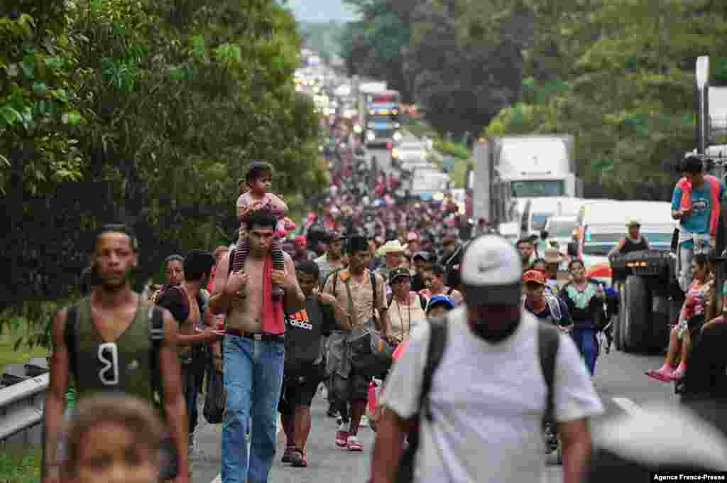 Migrants heading in a caravan to the U.S., walk towards Mexico City to request asylum and refugee status in Villa Comaltitlan, Chiapas State, Mexico.