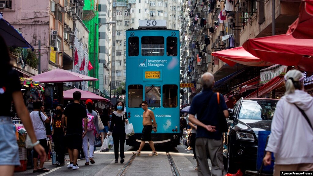 A tram makes its way through a street market in the North Point district of Hong Kong on Nov. 5, 2021.