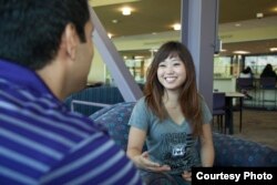 Weber State University students sit and talk inside one of the campus buildings in Ogden, Utah.