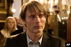 This image released by Magnolia Pictures shows Mads Mikkelsen in a scene from "The Hunt" (Jagten).