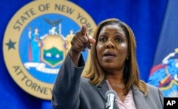 FILE - New York Attorney General Letitia James acknowledges questions from journalists at a news conference, in New York, May 21, 2021.