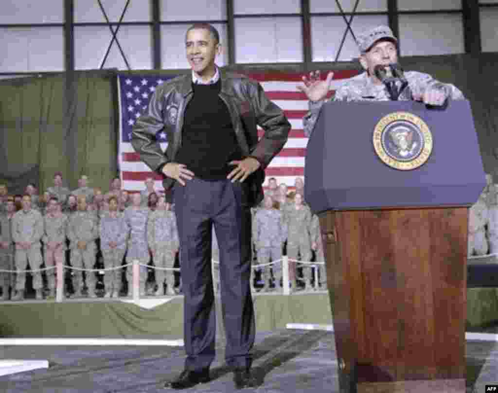 President Barack Obama is introduced to the troops by NATO Commander in Afghanistan Gen David Petraeus at a rally during an unannounced visit at Bagram Air Field in Afghanistan, Friday, Dec. 3, 2010. (AP Photo/Pablo Martinez Monsivais)