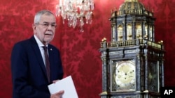 Austrian President Alexander Van der Bellen arrives for a statement about the political situation in the country at his residence the Hofburg Palace in Vienna, Austria, Oct. 10, 2021.