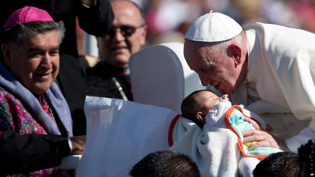 Pope Francis kisses a baby in San Cristobal de las Casas, Mexico, Feb. 15, 2016.
