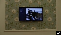 A picture of Carlos Gardel is is seen on a TV screen at the Carlos Gardel museum in Buenos Aires, Argentina, July 5, 2017.