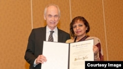 Dr. Sultana Nurun Nahar received John Wheatley award from the American Physical Society. The picture is with the President of APS.jpg