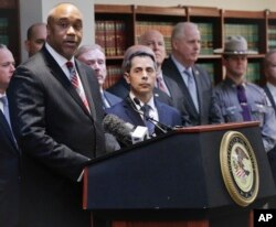 U.S. attorney Robert Capers, left, speaks during a news conference in Brooklyn, N.Y., announcing charges against Mexican drug kingpin Joaquin "El Chapo" Guzman as the alleged architect of a three-decade-long web of violence, corruption and drug traffickin