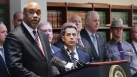U.S. attorney Robert Capers, left, speaks during a news conference in Brooklyn, N.Y., announcing charges against Mexican drug kingpin Joaquin