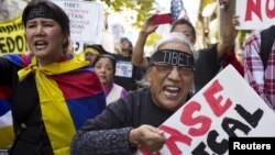 Protesters shout during a pro-Tibet march as Chinese President Xi Jinping