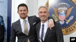 Actor Channing Tatum, left, and director Roland Emmerich attend the "White House Down" premiere at the Ziegfeld Theatre, June 25, 2013 in New York.