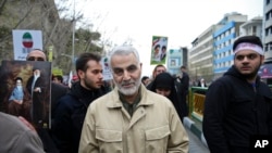 FILE - Revolutionary Guard General Qassem Soleimani attends an annual rally commemorating the anniversary of the 1979 Islamic revolution, in Tehran, Iran, Feb. 11, 2016.