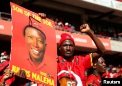 A supporter of Julius Malema's Economic Freedom Fighters (EFF) party holds a placard at the party's final election rally ahead of the country's May 8 poll, in Johannesburg, South Africa, May 5, 2019.