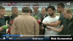 In the screen shot from www.1tv.ru, Captain Konstantin Murakhtin, the surviving airman of the downed Russian fighter jet, speaks to Russian TV journalists.