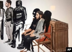 FILE - In this courtroom sketch, Salah Abdeslam, right, and Soufiane Ayari, left, appear at the Brussels Justice Palace in Brussels on Monday, Feb. 5, 2018.