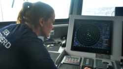Carmen McGregor checks the radar system on July 18, 2021, as part of the ship’s 18-day voyage to observe up close the activities of the Chinese distant water fishing fleet off the west coast of South America.
