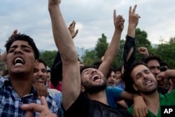 Kashmiri villagers shout slogans during the funeral procession of Burhan Wani, chief of operations of Indian Kashmir's largest rebel group, in Indian-controlled Kashmir, July 9, 2016.