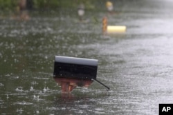 A mailbox on Mill Creek Road is barely above water after Florence hit Newport, N.C., Sept. 15, 2018. A day after blowing ashore, Florence practically parked itself over land all day long and poured on the rain.