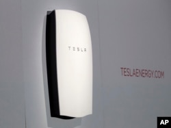 Tesla's newest product "Powerwall" is unveiled on stage in Hawthorne, Calif., April 30, 2015. Tesla CEO Elon Musk is trying to steer his electric car company's technology into homes and businesses as part of an elaborate plan to reshape the power grid with millions of small power plants made of solar panels on roofs and batteries in garages.