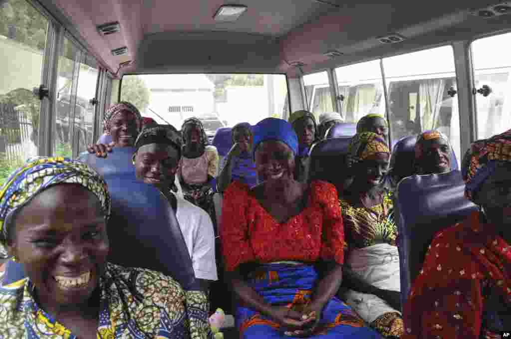 Family members of the Nigerian Chibok kidnapped girls share a moment as they depart to the Nigerian minister of women affairs in Abuja.