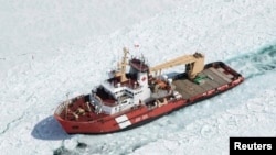 FILE - The Canadian Coast Guard Ship (CCGS) Samuel Risley, an icrebreaker, is shown in this aerial photo near Whitefish Bay on Lake Superior northwest of Sault Ste. Marie, Ontario, April 7, 2015. 