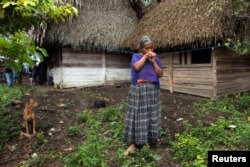 Elvira Choc, 59, grandmother of Jakelin Caal Maquin, a 7-year-old girl who died in U.S. custody, stands outside her house in Raxruha, Guatemala, Dec. 15, 2018.