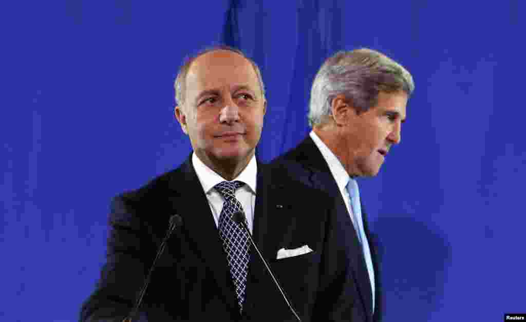 U.S. Secretary of State John Kerry (R) joins French Foreign Minister Laurent Fabius at a news conference after a meeting regarding Syria, at the Quai d&#39;Orsay in Paris, France. 