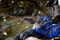 Ammunitions are seen left on a bed inside an army-linked militia post a day after clashes between Myanmar forces and ethnic rebels in Muse, May 13, 2018.