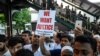 Membros da comunidade muçulmana em Queens, Noba Iorque, pedem justiça pela morte do Iman Maulama Akonjee