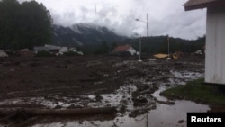 A landslide, brought on by a night of torrential rain, damaged Villa Santa Lucia, Los Lagos, Chile, Dec. 16, 2017.