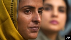 Pakistani gang rape victim Mukhtar Mai, left, addresses a news conference with lawmaker and Executive Director of Parliamentarian Human Rights Commission Kashmala Tariq in Islamabad, Pakistan on March 17, 2005. 