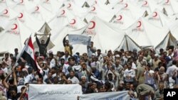 Syrian refugees hold a demonstration in favor of Turkey at a refugee camp in the Turkish border town of Boynuegin in Hatay province, June 17, 2011