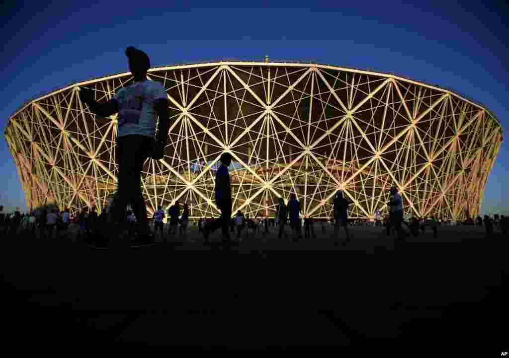 People walk around the stadium before the Group G match between Tunisia and England at the 2018 World Cup in Volgograd, Russia.