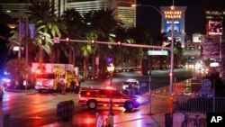 Police and emergency crews respond to the scene of a car accident along Las Vegas Boulevard, Sunday, Dec. 20, 2015.