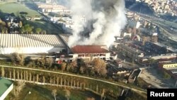 A general view from helicopter shows a large fire that has broken out in a municipal rubbish dump on the northern outskirts of Rome, Italy, Dec. 11, 2018. (Vigili del Fuoco)