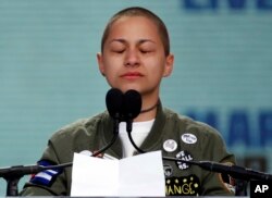 Emma Gonzalez, a survivor of the mass shooting at Marjory Stoneman Douglas High School in Parkland, Fla., closes her eyes and cries as she stands silently at the podium for the amount of time it took the Parkland shooter to kill 17 students.