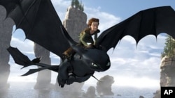 Toothless, a Night Fury Dragon – the rarest of all kind – soars through the sky with Hiccup (Jay Baruchel) on his back in a scene from "How to Train Your Dragon"