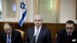 Israeli Prime Minister Benjamin Netanyahu, center, convenes the weekly cabinet meeting in Jerusalem, March 6, 2011