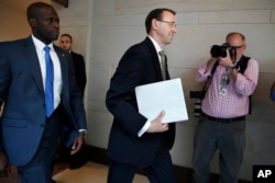 Deputy Attorney General Rod Rosenstein arrives on Capitol Hill in Washington for a closed-door meeting with Senators a day after appointing former FBI Director Robert Mueller to oversee the investigation into possible ties between Russia and President Don