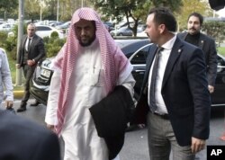 FILE - Saudi Arabia's top prosecutor Saud al-Mojeb walks to board a plane to leave Turkey, in Istanbul, Oct. 31, 2018.