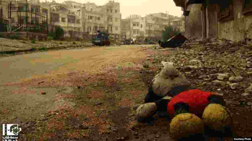 Mickey Mouse doll in abandoned Al-Khaldiya district of Homs, Syria, January 3, 2013 (Lens Young Homsi)