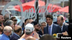 Canada’s Prime Minister Justin Trudeau attends the site of the mass shooting on Danforth Avenue in Toronto, Ontario, Canada, July 30, 2018. 