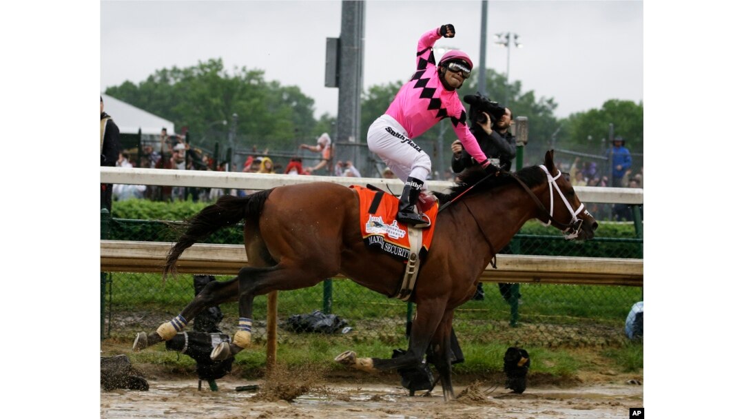 Luis Saez rides Maximum Security across the finish line first during the 145th running of the Kentucky Derby horse race at Churchill Downs, May 4, 2019, in Louisville, Ky.