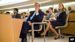 U.S. Secretary of State John Kerry waits for his turn to deliver remarks to the United Nations Human Rights Council March 2, 2015, in Geneva.