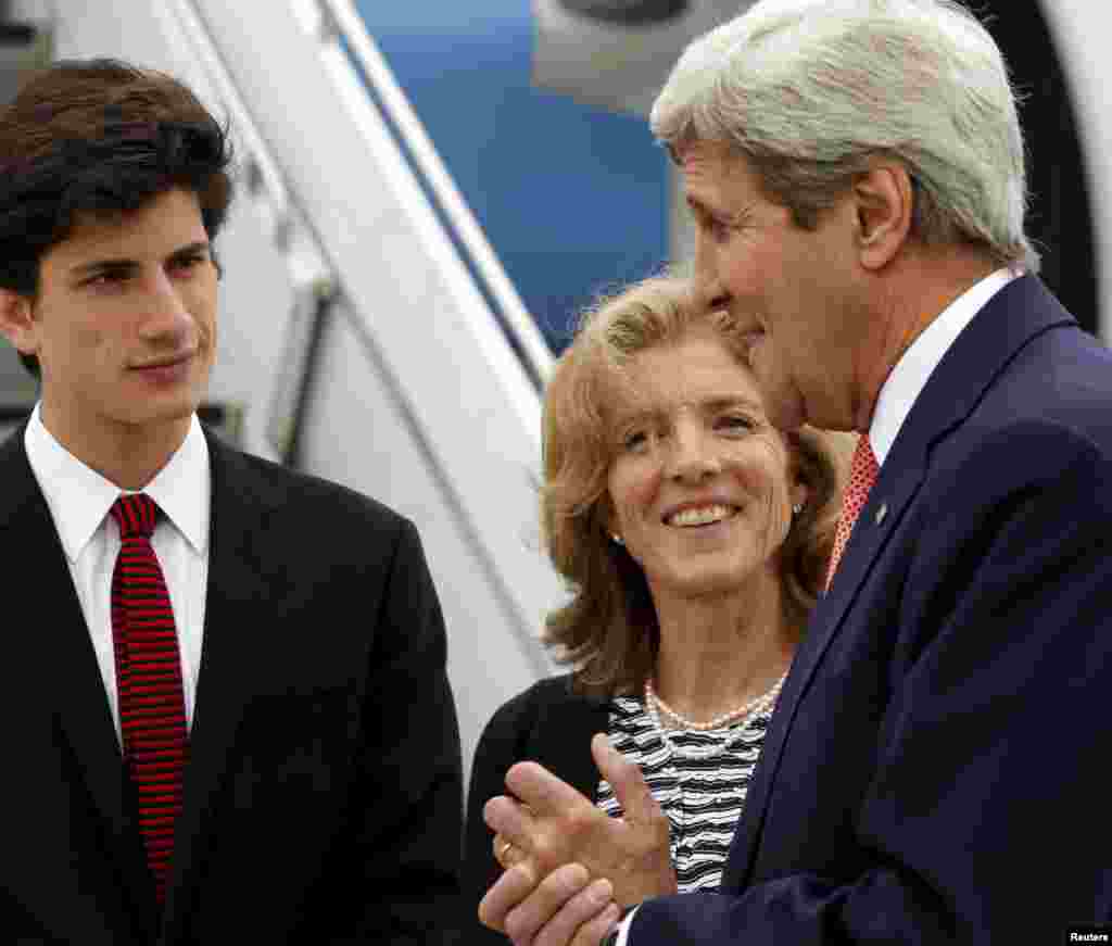 U.S. Ambassador to Japan Caroline Kennedy and her son, Jack Schlossberg, greet Secretary of State John Kerry as he arrives, ahead of G-7 foreign minister meetings, at Marine Corps Air Station Iwakuni, Japan, April 10, 2016.