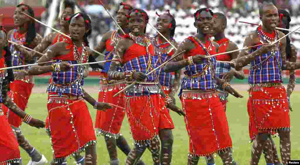 Kenyan students perform a Maasai traditional warrior song during the Mashujaa Day (Hero&#39;s Day) celebrations at the Nyayo National Stadium in Nairobi. The national holiday remembers those who had taken part in the country&#39;s struggle for liberation. 