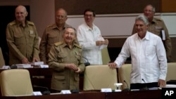 Cuba's President Raul Castro, front left, and Vice President Miguel Diaz-Canel, front right, attend a National Assembly session in Havana, Cuba, July 15, 2015.